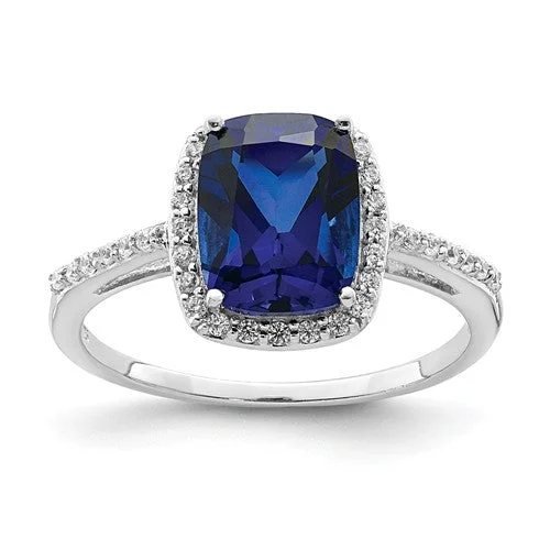 Emerald Gemstone Rings with Filigree - Bordered SettingsSterling Silver Cushion Cut Lab-Created Blue Sapphire & CZ Halo Ring