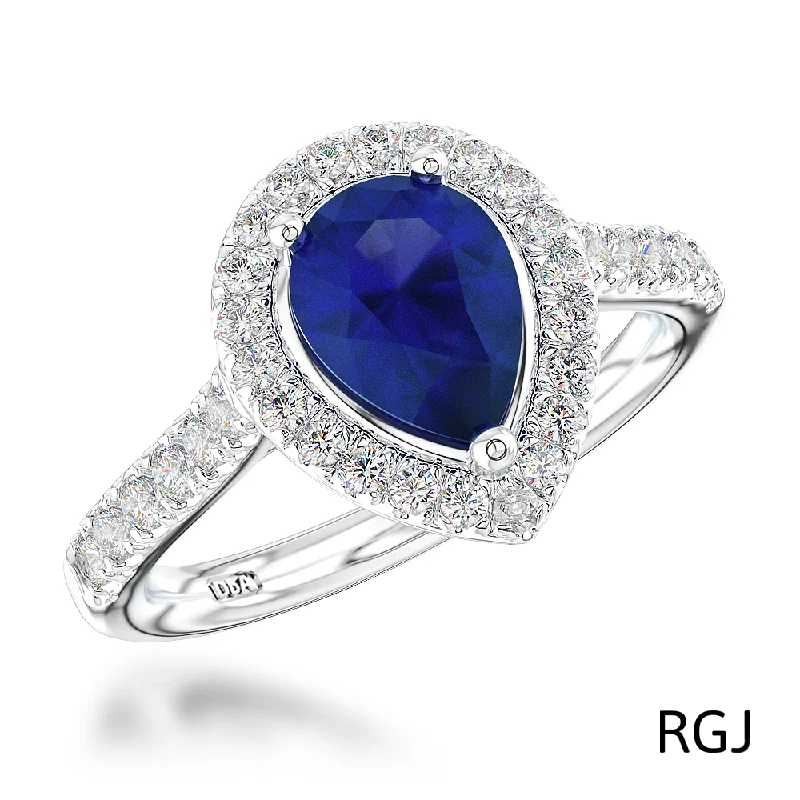 Three - Stone Diamond Rings with Princess - Cut DiamondsThe Skye Platinum 0.76ct Pear Cut Blue Sapphire Ring With 0.33ct Diamond Halo And Diamond Set Shoulders