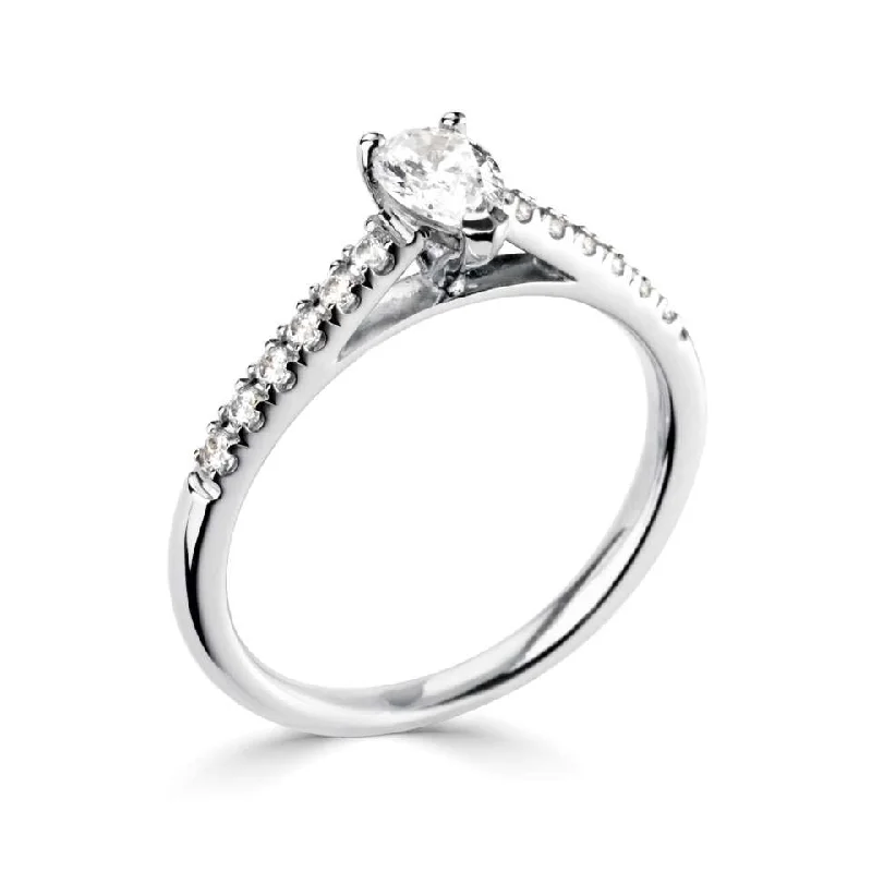 Halo - Style Diamond Rings with Smaller Accent DiamondsThe Mistletoe Platinum Pear Cut Diamond Solitaire Engagement Ring With Diamond Set Shoulders