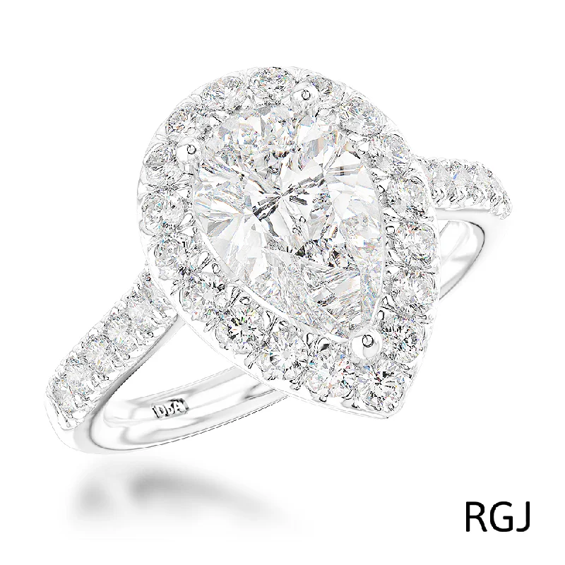 Vintage - Inspired Diamond Rings with Filigree WorkThe Evie Platinum Pear Cut Diamond Engagement Ring With Diamond Halo And Diamond Set Shoulders