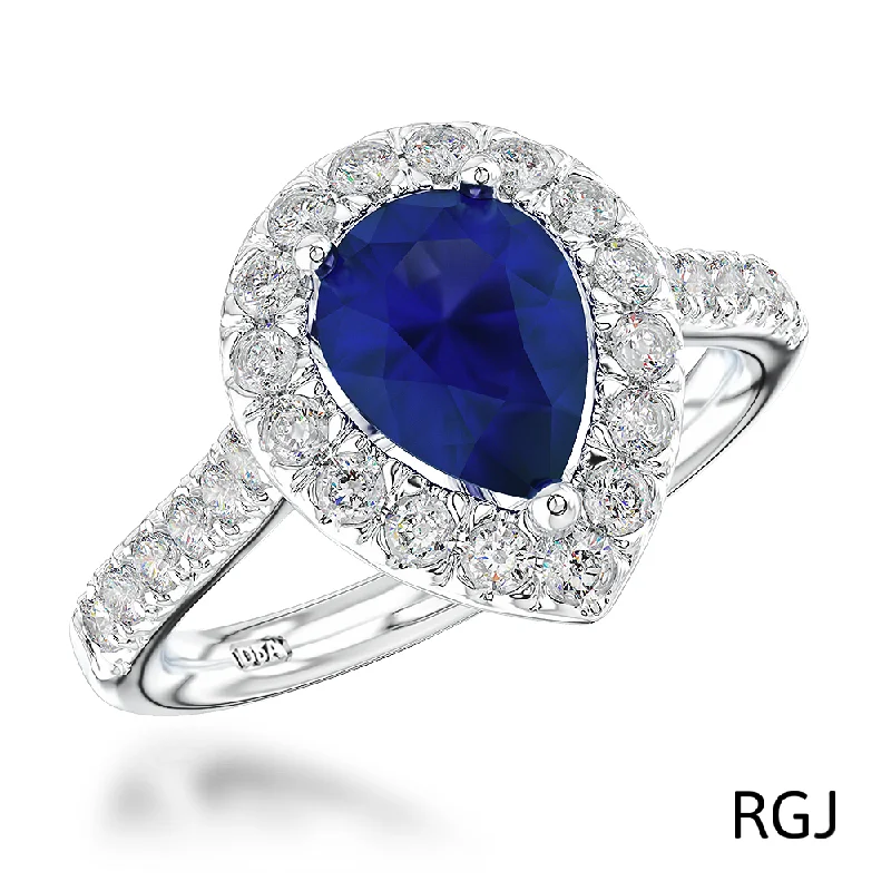 Vintage - Inspired Diamond Rings with Filigree WorkThe Evie Platinum 0.77ct Pear Cut Blue Sapphire Ring With 0.44ct Diamond Halo And Diamond Set Shoulders