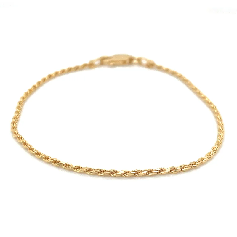 Solid Gold Bangles with Intricate EngravingsGolden Rope Bracelet